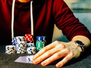 How to Stack the Odds In Your Favor with Rapid Decision-Making - Man at Poker Table with Chips